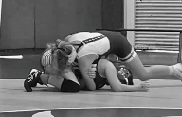 Competitive Match- Alexa Godoy getting her opponent in a half -nelson in her regionals match.